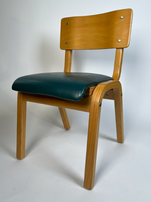 Vintage child chair with green seat