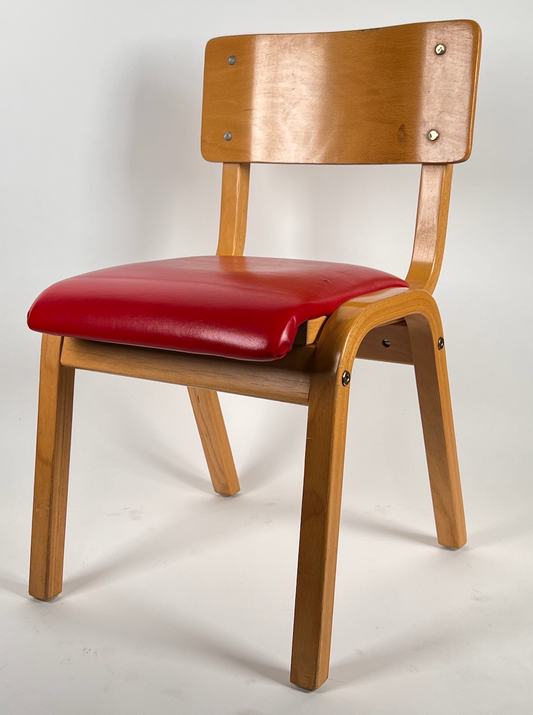 Vintage child chair with red seat