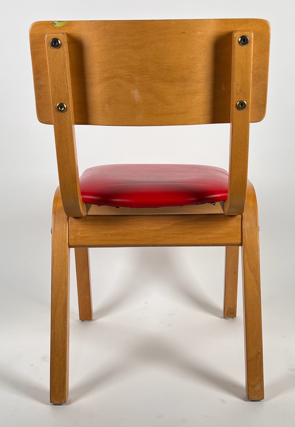 Vintage child chair with red seat
