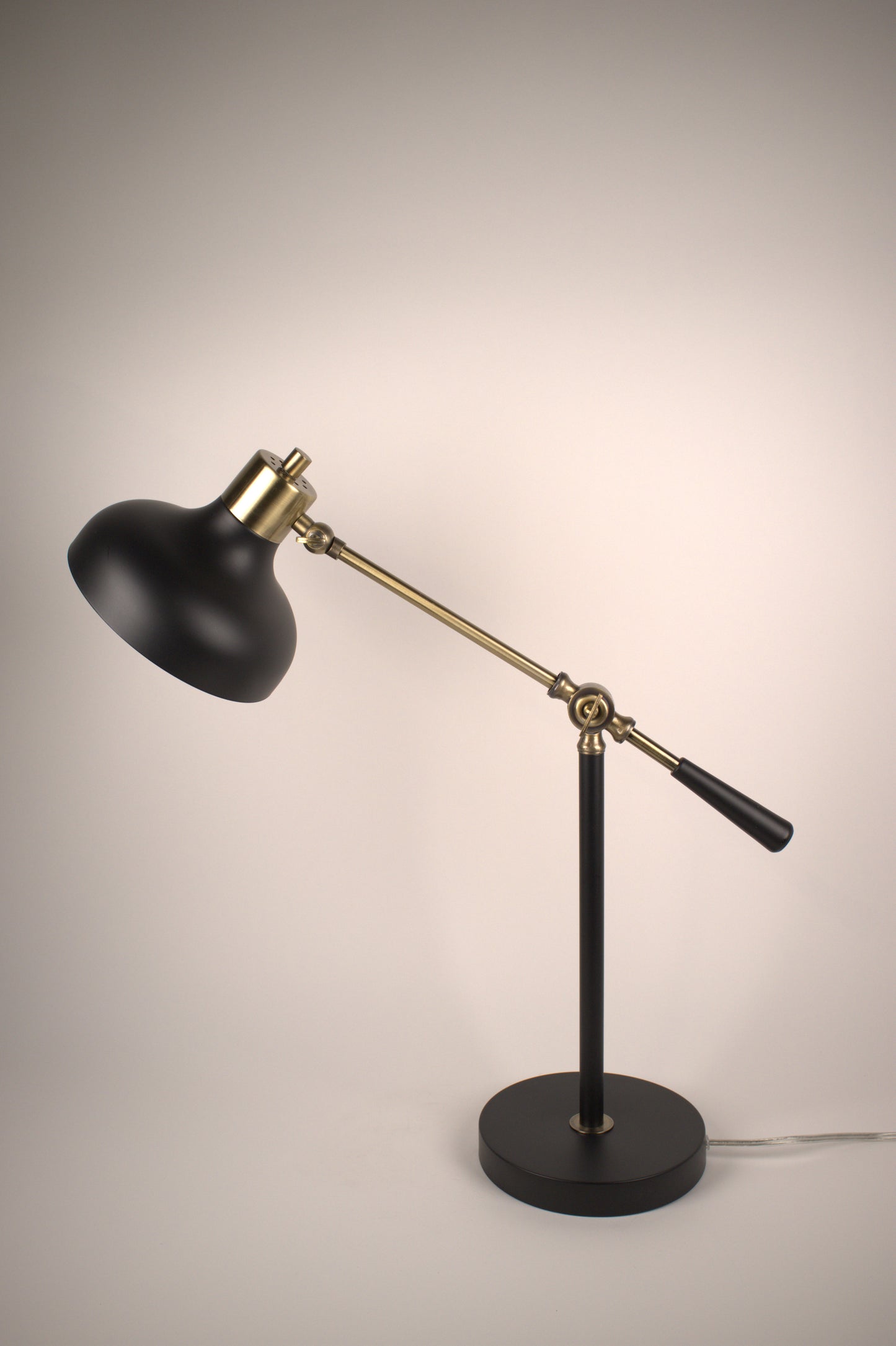 Articulating black and brass desk lamp