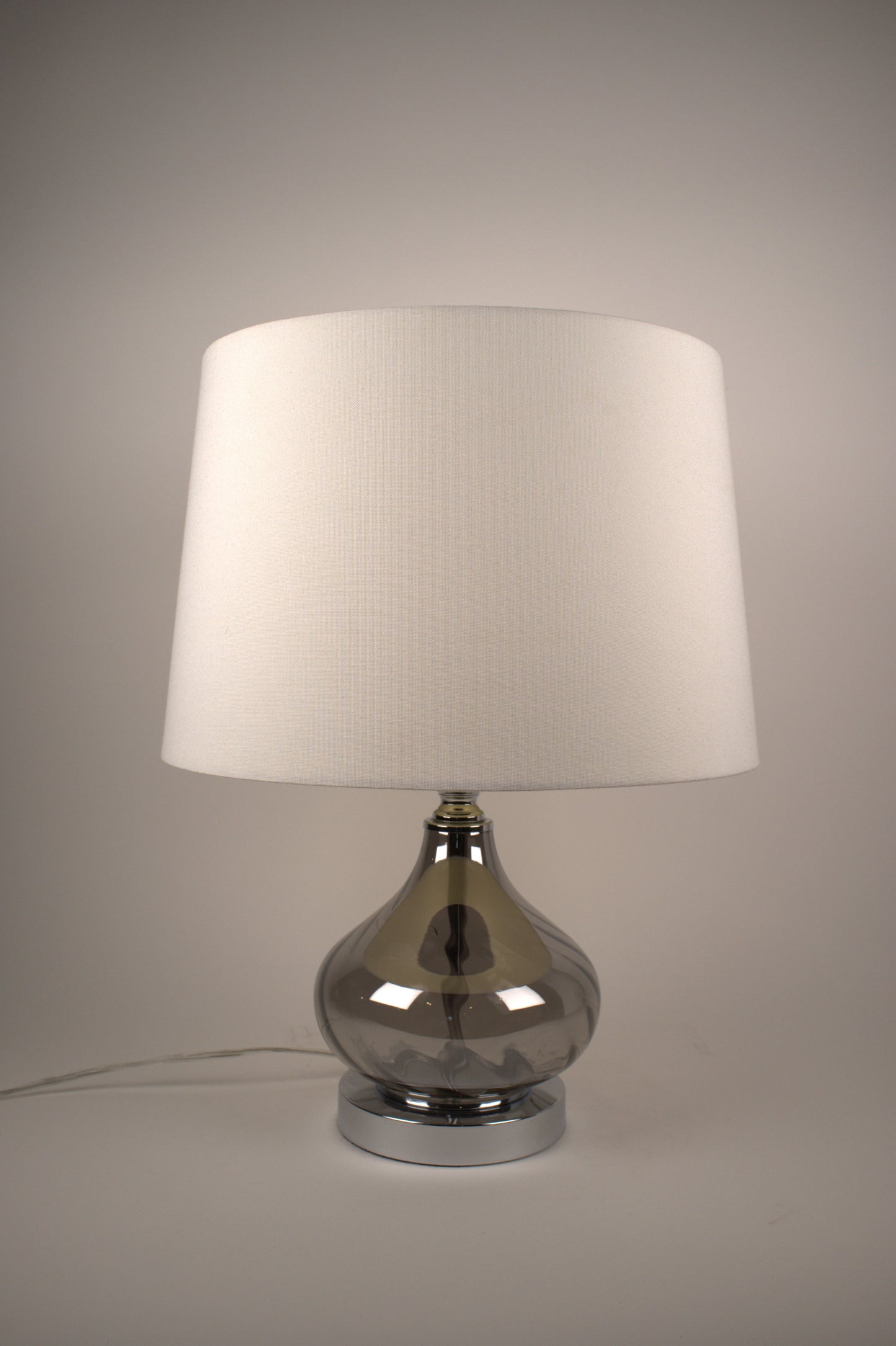 Short reflective gray table lamp