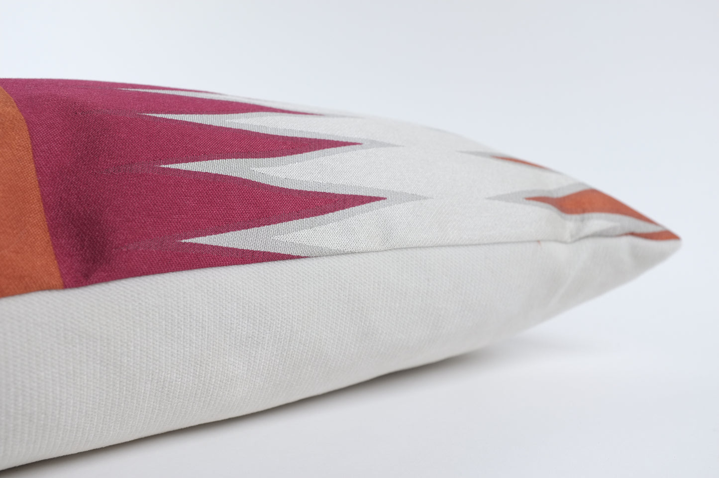 White with Red/Orange Spike Design Lumbar Pillow