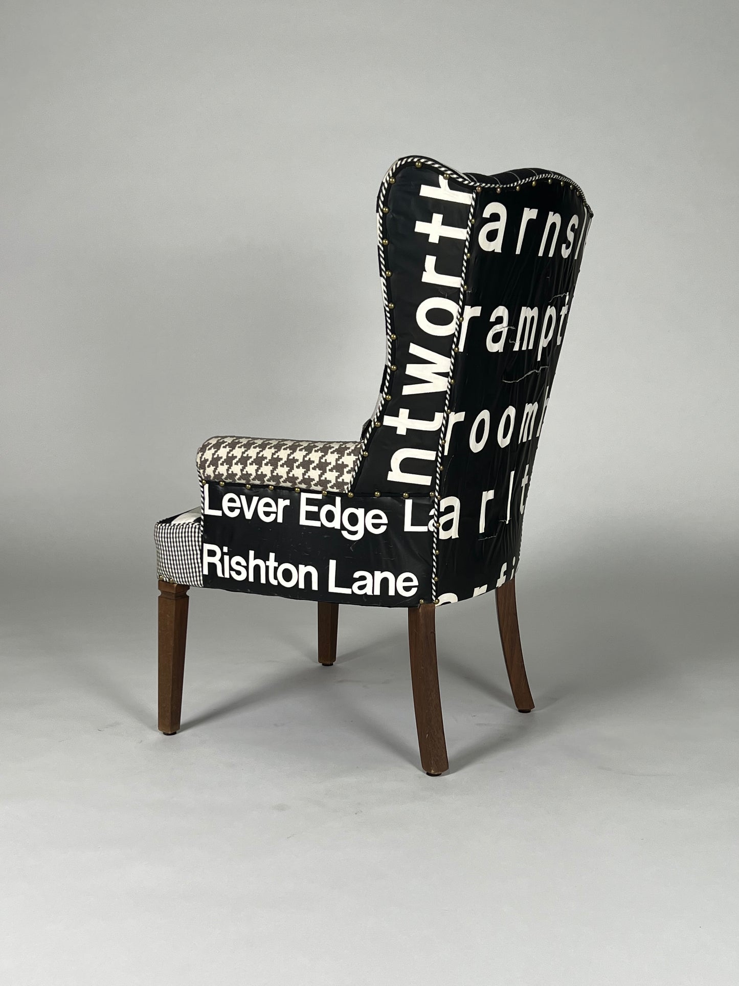 Multi patterned high back chair with vintage transit sign back, v1