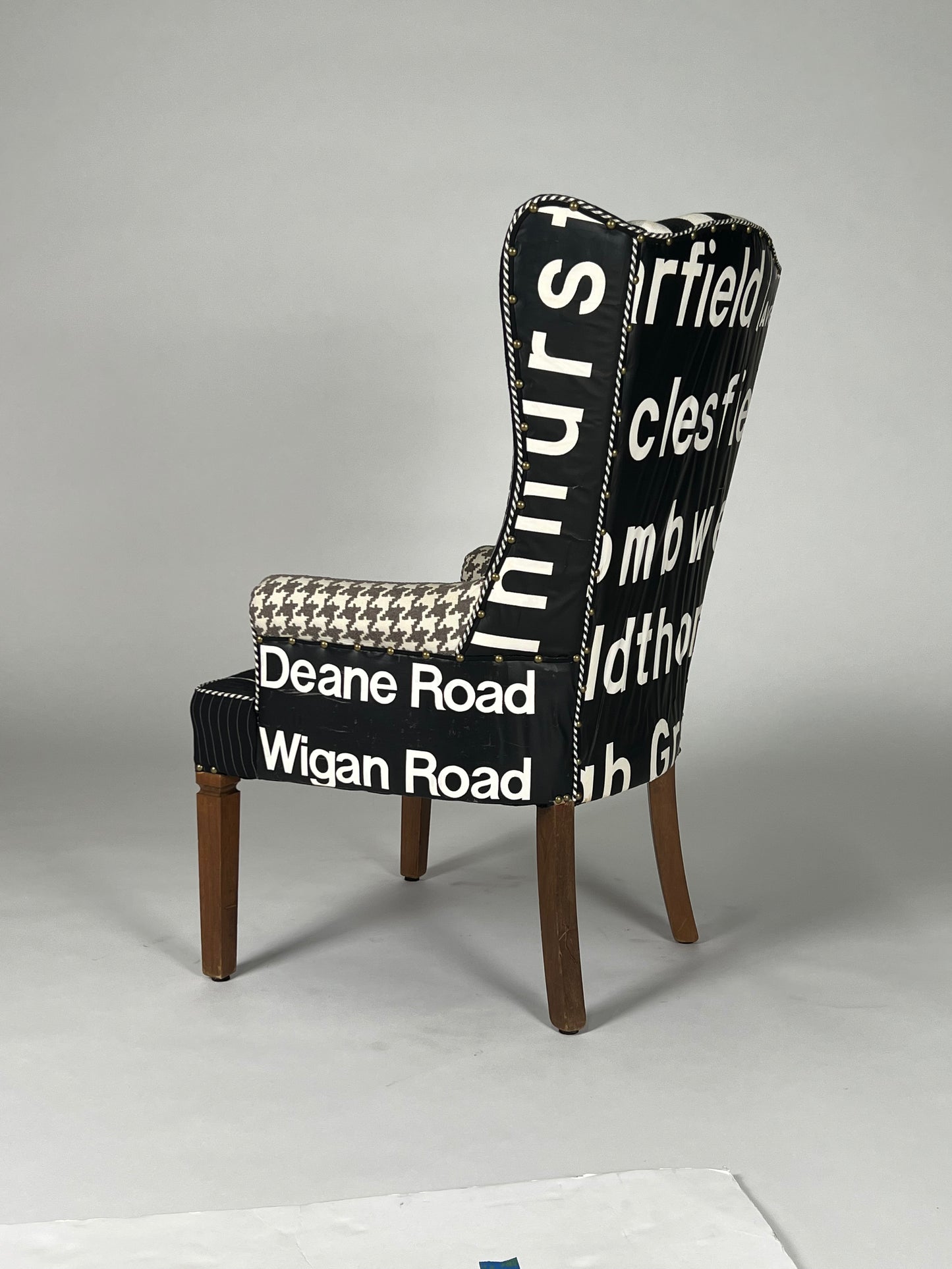 Multi patterned high back chair with vintage transit sign back, v2