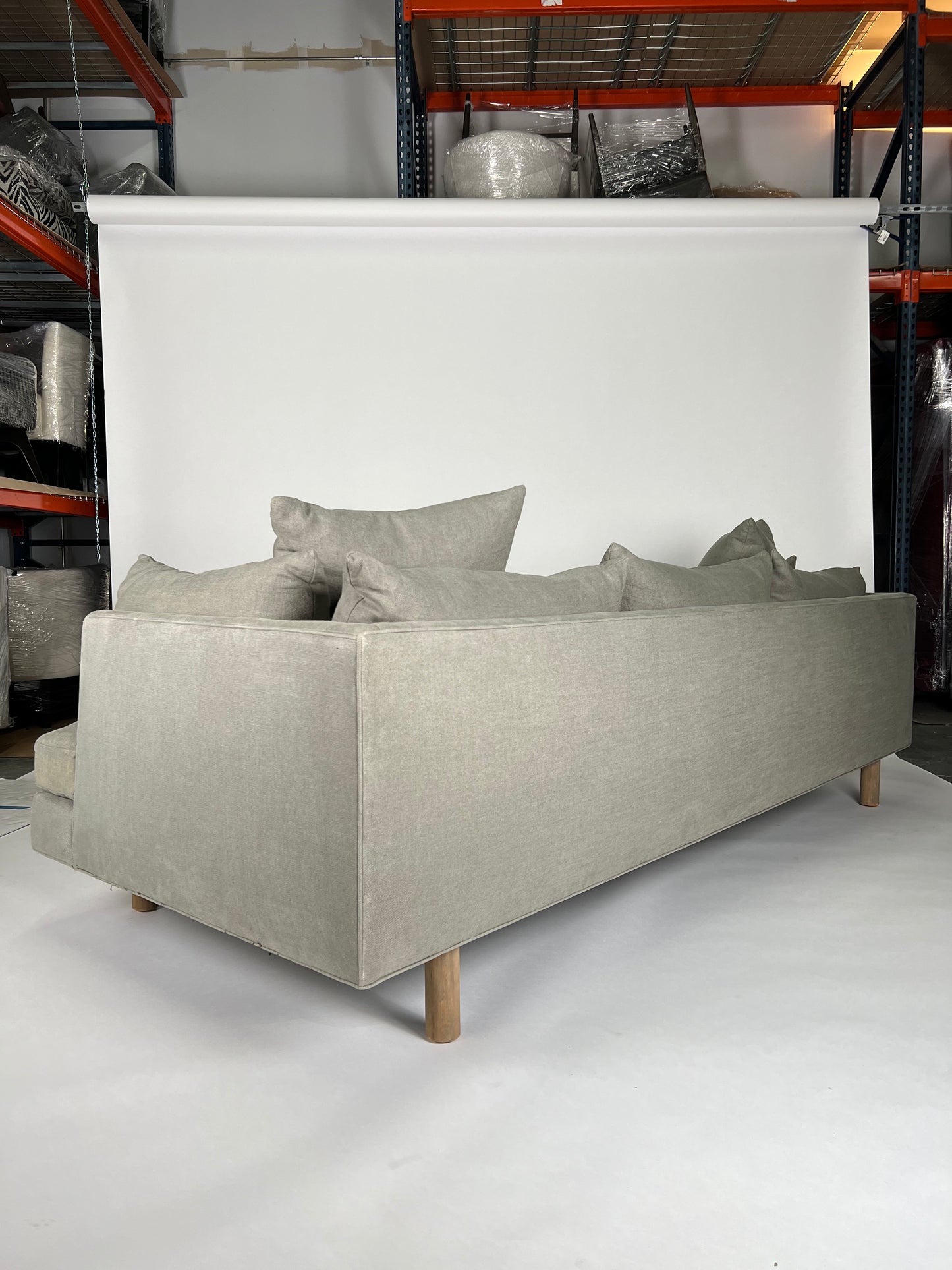 Sage linen sofa with deep seat and natural wooden legs