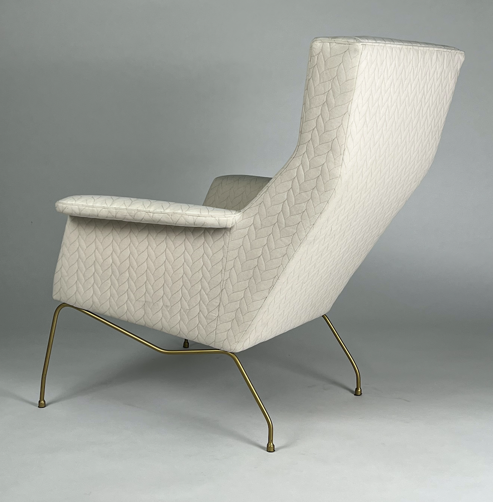 Cream tall back chair with stitched cable pattern, brass legs