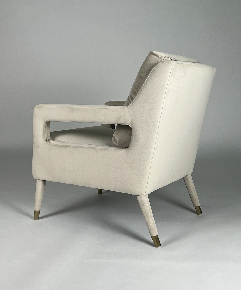 Cream velvet square arm chair with brass tips on legs