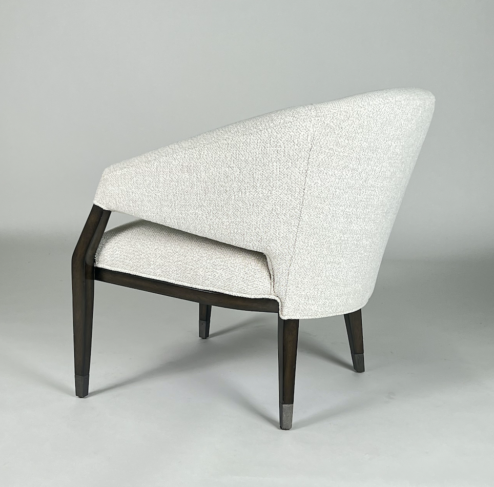 Off white fabric chair with dark wood frame, round back