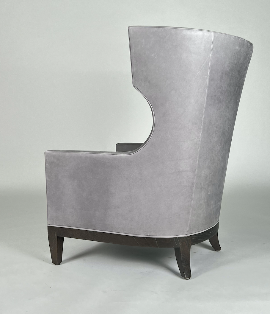 Soft gray leather, tall modern wing back chair with rounded back and dark legs