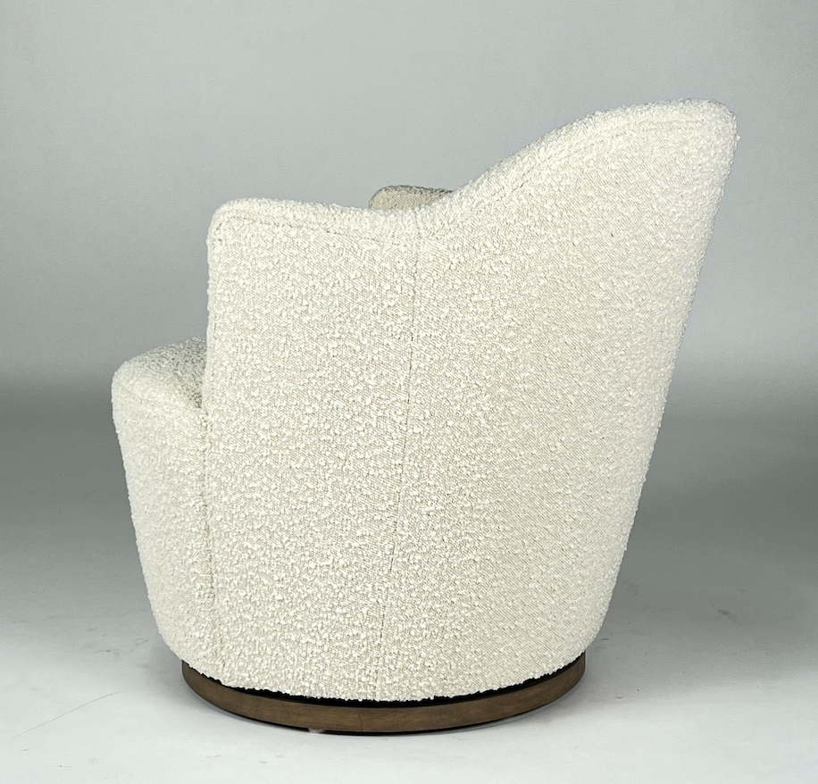 Cream boucle fabric swivel chair, wooden base