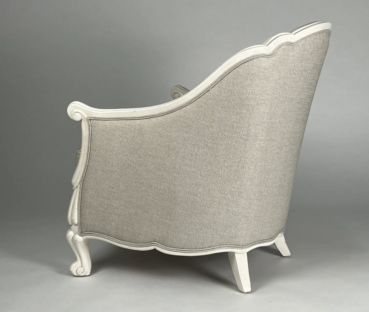 Silvery fabric chair with white carved frame, round back, traditional style