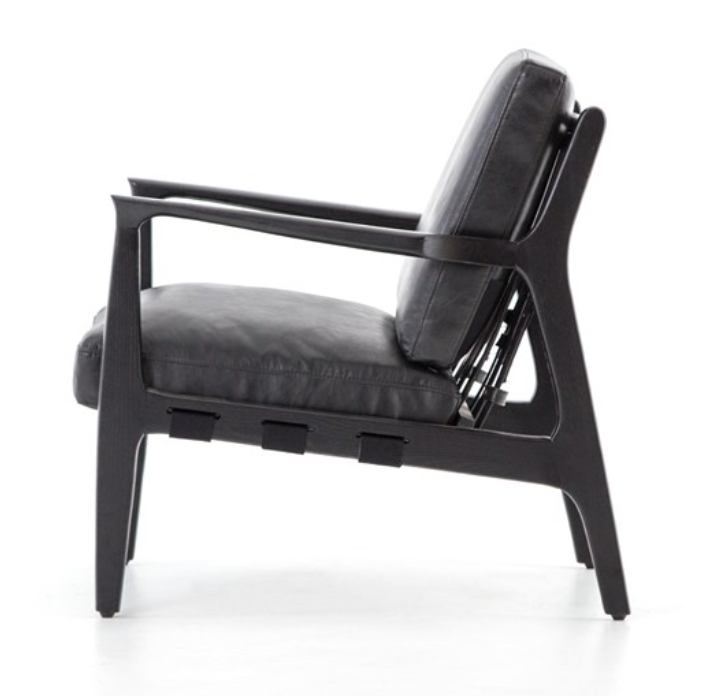 Black hand finished leather chair with black wood frame. Back has strapping made of canvas, leather and buckles