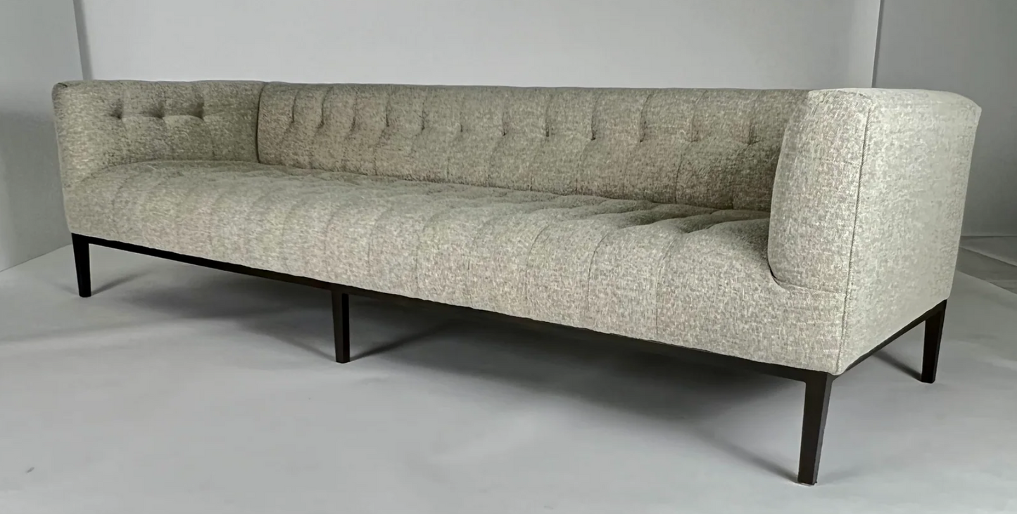 Honey wheat upholstered sofa, blind tufting, gunmetal toned legs