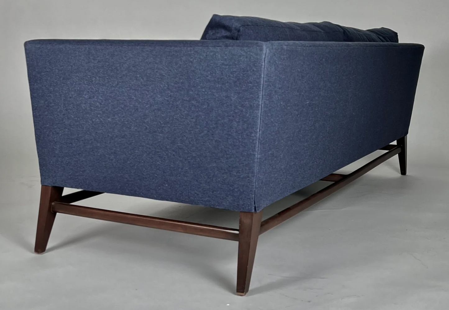 Indigo flannel sofa, dark walnut wood frame