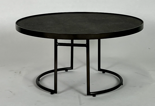 Round coffee table with black leather top and black base