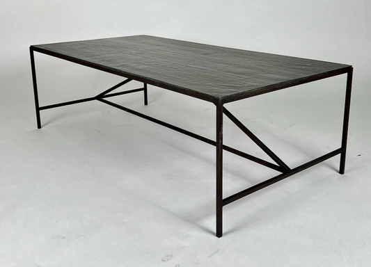 Black metal coffee table with carved looking top