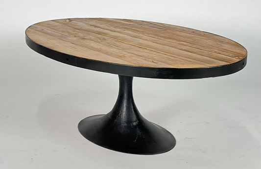 Oval coffee table with wood top and black metal pedestal base