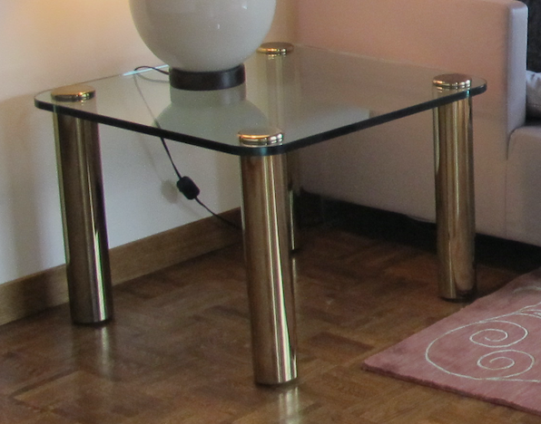 Vintage side table, brass legs and heavy glass top