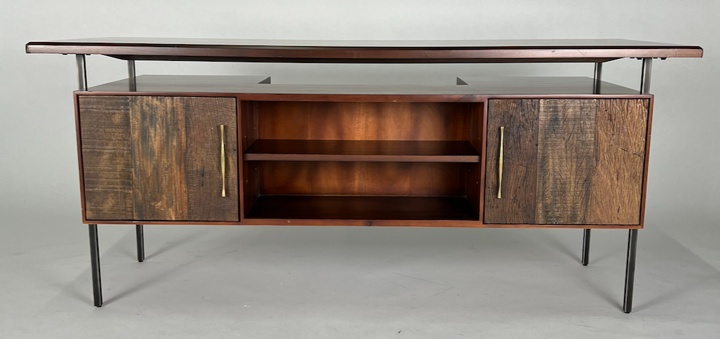 Dark wood desk with brass hardware, floated top, iron legs