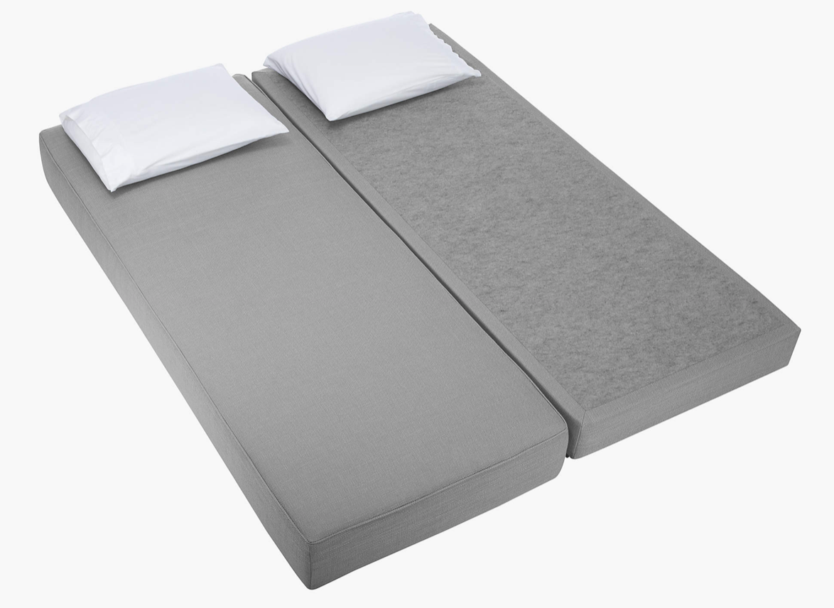 Silvery gray fabric daybed with bolster, unfolds into a bed for two