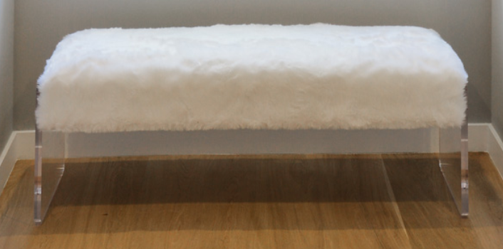 White faux fur bench with clear acrylic slab legs