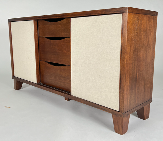 Brown wood buffet with cream linen panels
