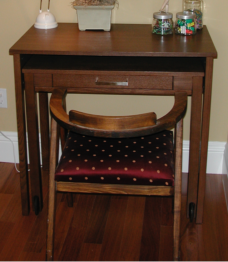 Small brown wood desk, lower portion pulls out