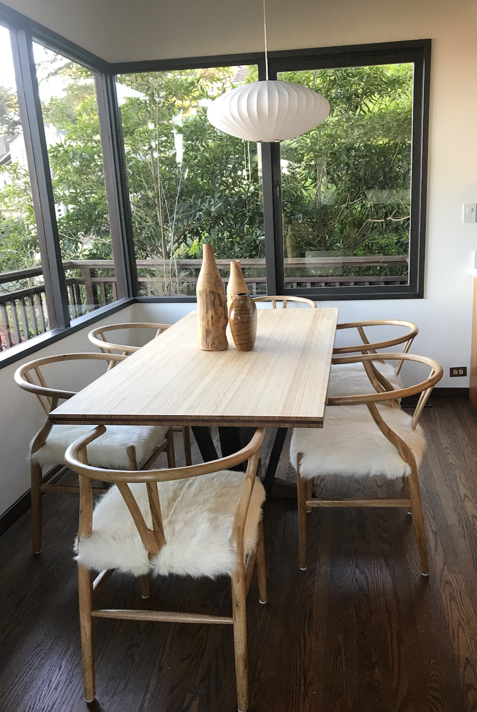 Blonde wishbone chair with white goat hair seat