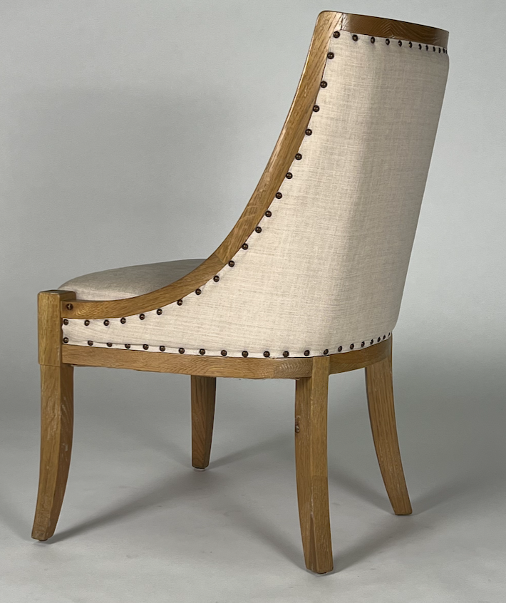 Sweep area wood frame chair with light tan upholstery, nailhead trim