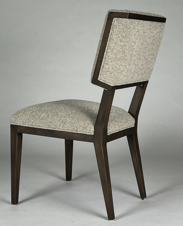 Light tan speckled fabric with wood frame dining chair