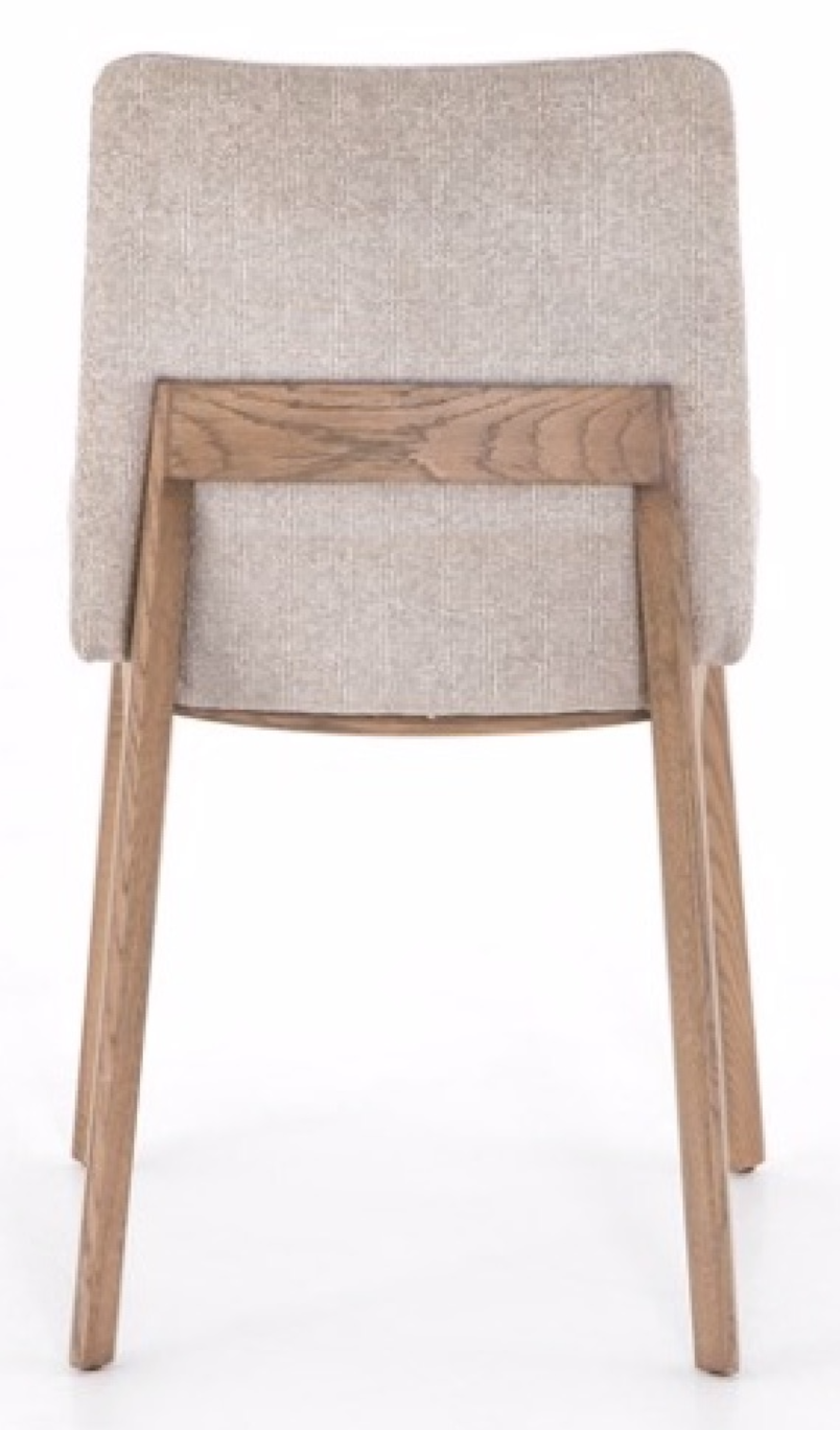 Natural wood frame dining chair with light tan upholstery