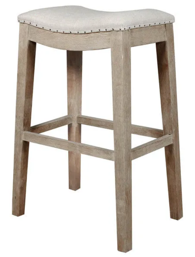 White washed wood bar stool with linen seat, nailhead trim