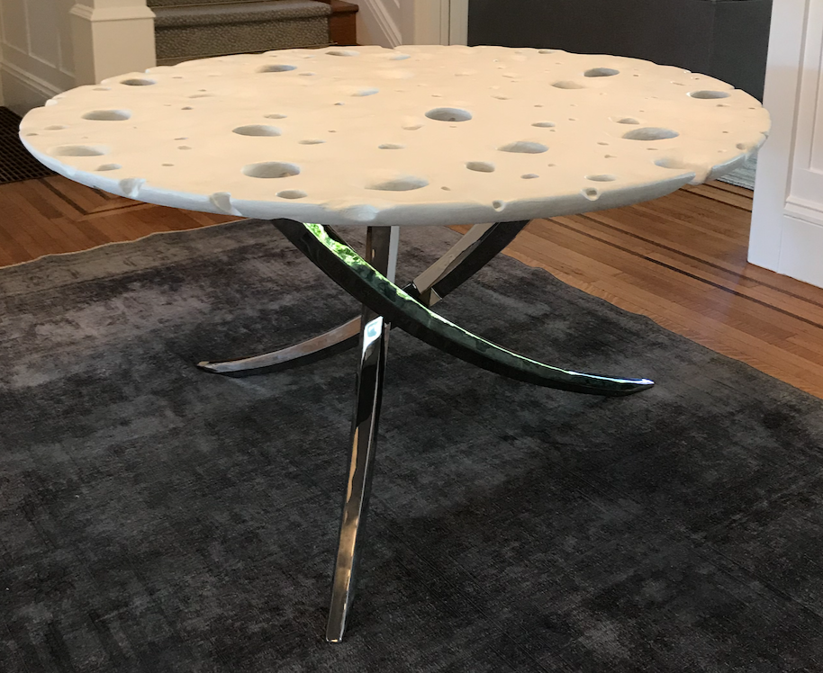 Round white Swiss cheese moon table with chrome 3 legged base