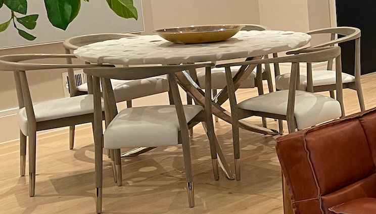 Round white Swiss cheese moon table with chrome 3 legged base