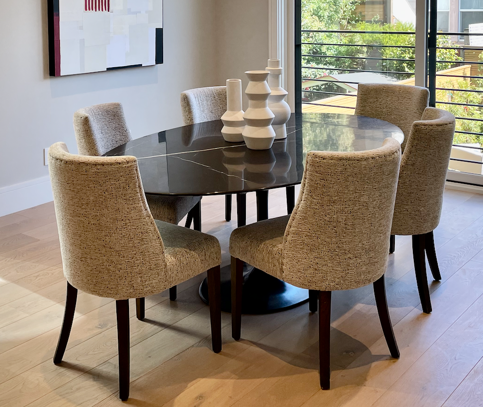 Oval black marble Saarinen like dining table with black pedestal base