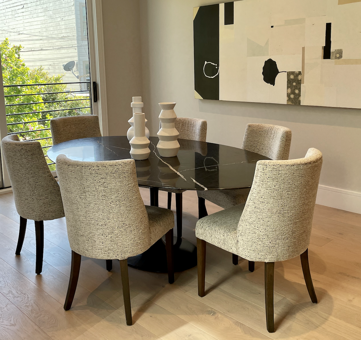 Oval black marble Saarinen like dining table with black pedestal base