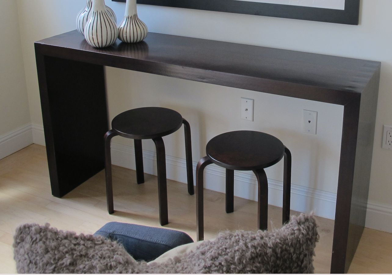 Wood console table with cinnamon bark inlay